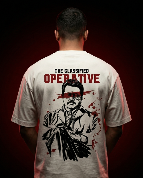 Oversized off-white graphic t-shirt worn by male model from back featuring bold “classified operative” design with illustrated cinematic spy character, inspired by Indian crime thriller and undercover agent aesthetic, gangster style streetwear India, premium oversized t shirt for men
