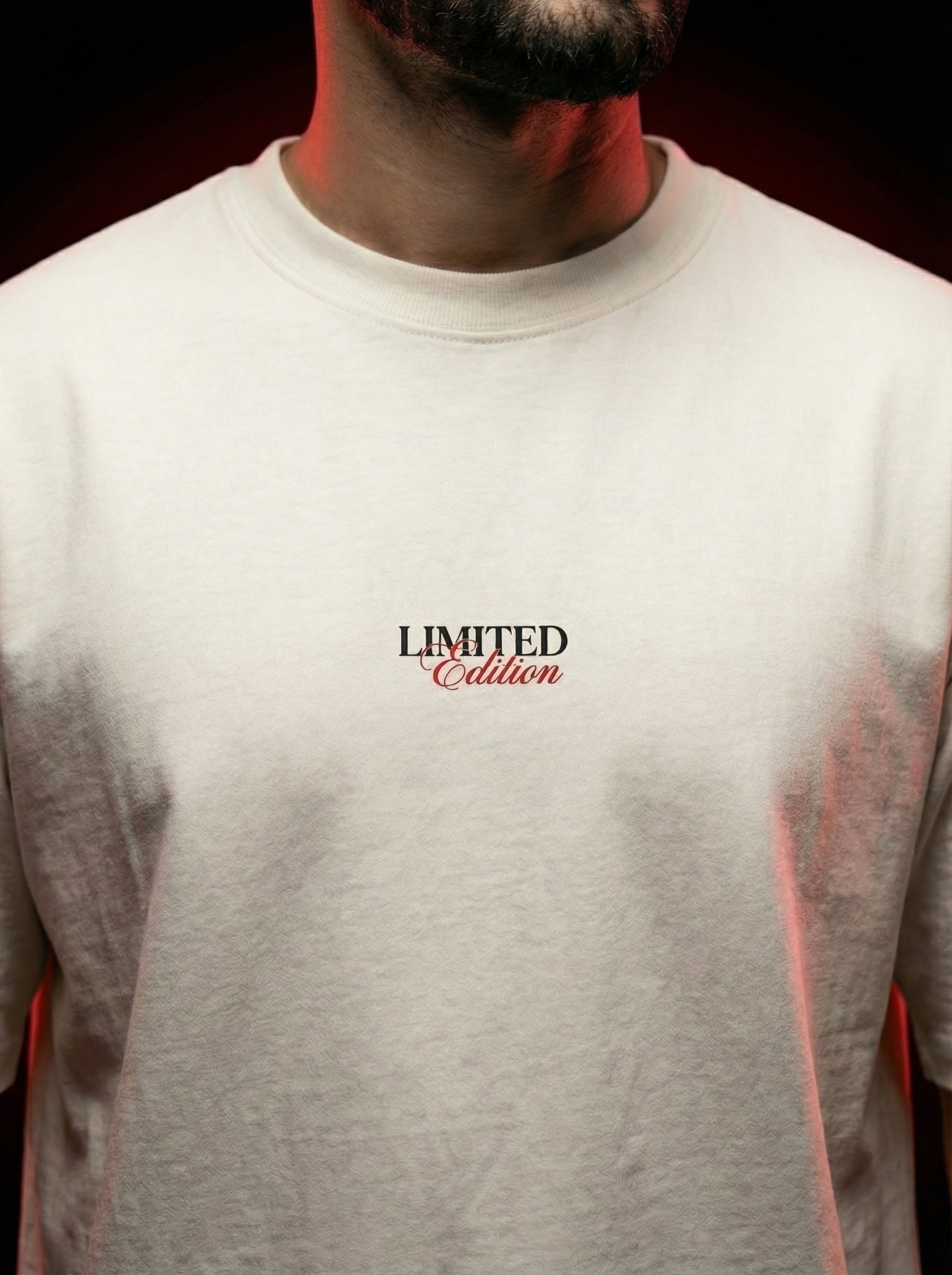 Front view of oversized off-white t-shirt with minimal “limited edition” chest print, clean premium cotton fabric, modern streetwear India, cinematic fashion inspired by bollywood crime and spy aesthetic outfits for men