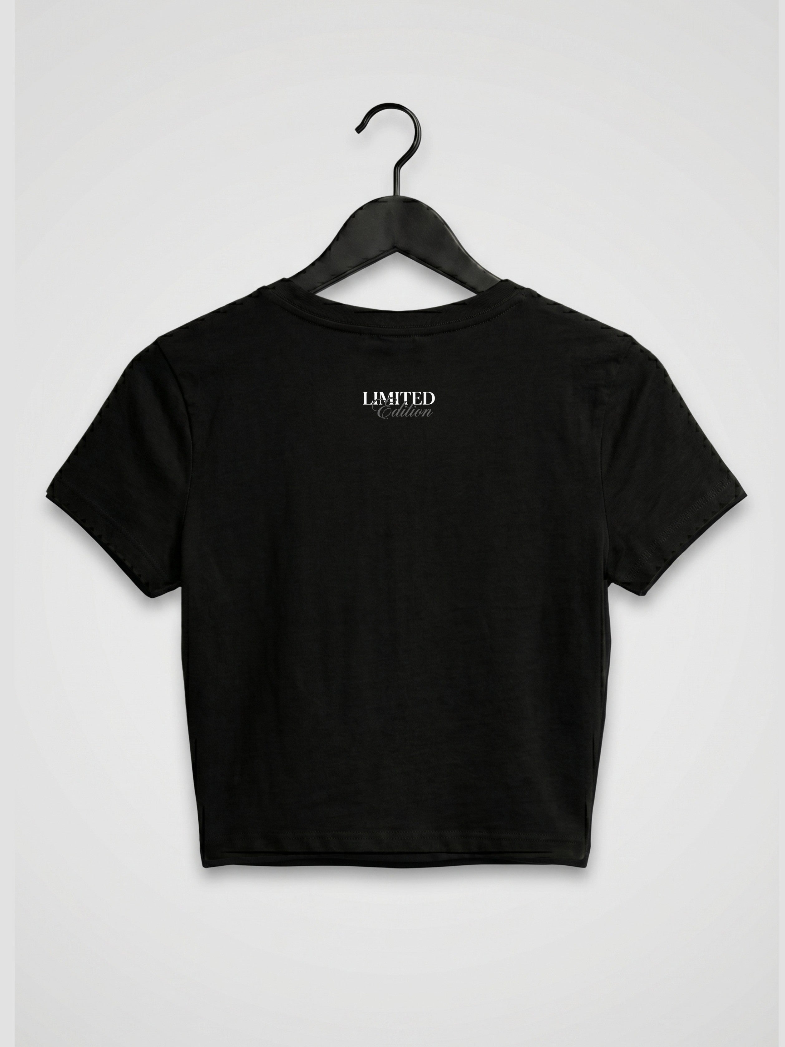 Back view of black women’s crop top with minimal limited edition print, premium gen z streetwear inspired by dhurandhar aesthetic and underground rap reble vibe
